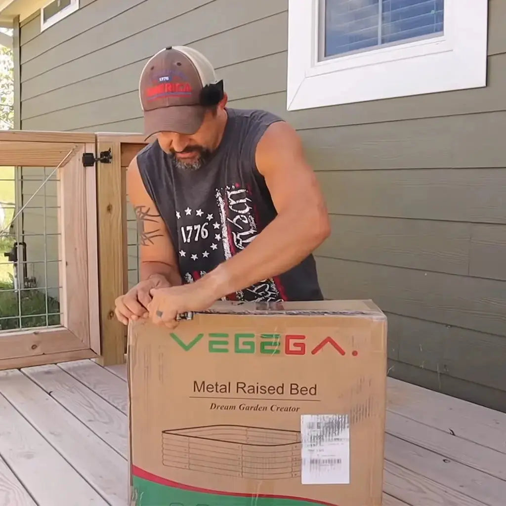 a man open the package of 8x4 galvanized raised flower bed-Vegega