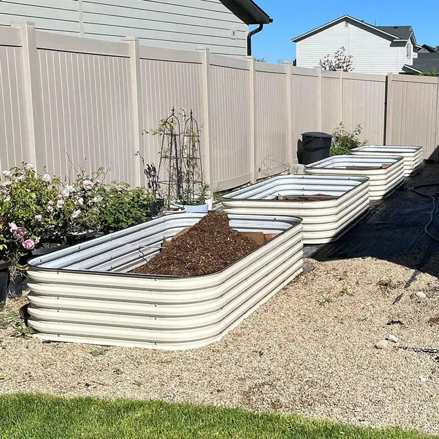 filling soil in raised beds-Vegega