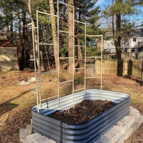 metal wall trellis installed on garden bed